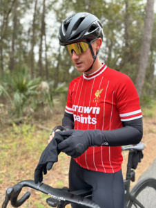 male cyclist putting on gloves