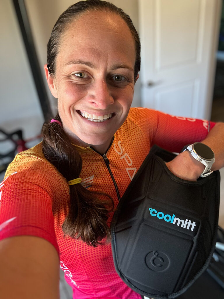 A female triathlete using the Cool Mitt device.