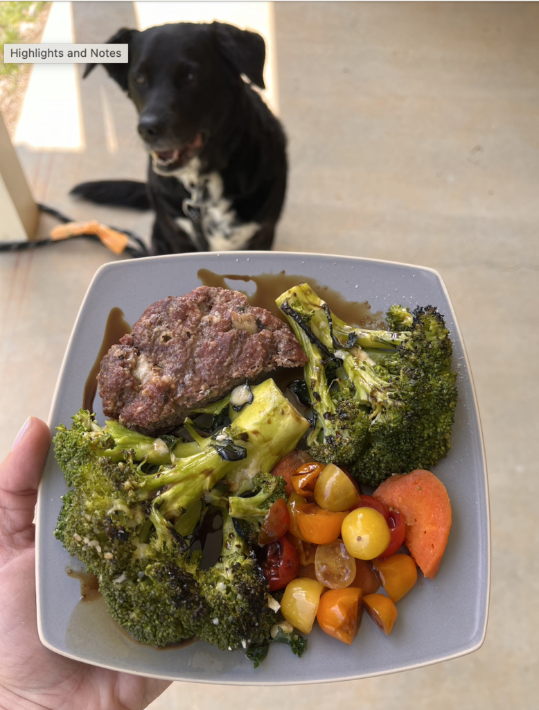 an iron-rich meal with a plate of meat, broccoli, and tomatoes
