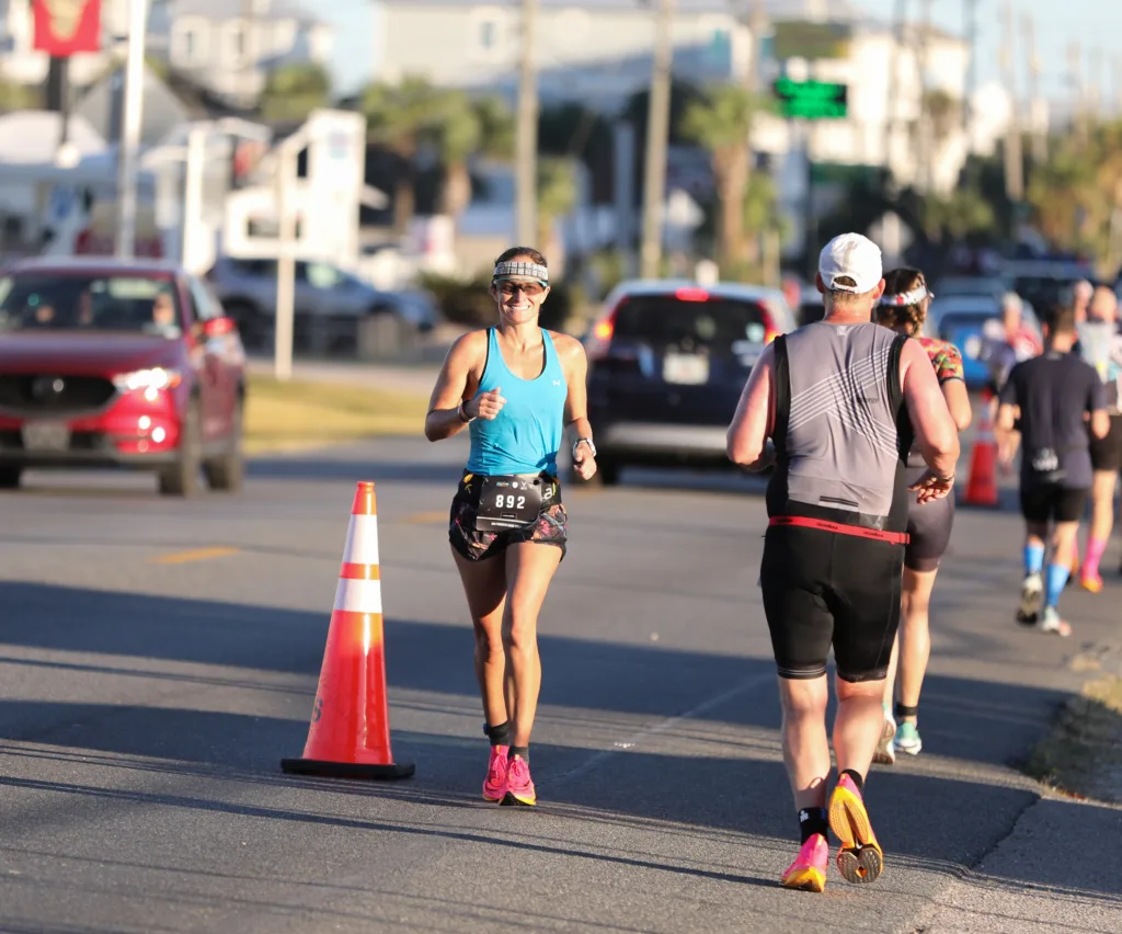 A woman running in a triathlon at Ironman Florida