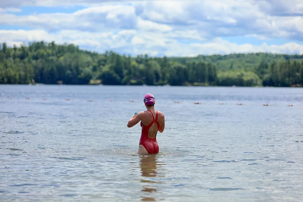 A female swimmer ingesting ready to do open water swimming