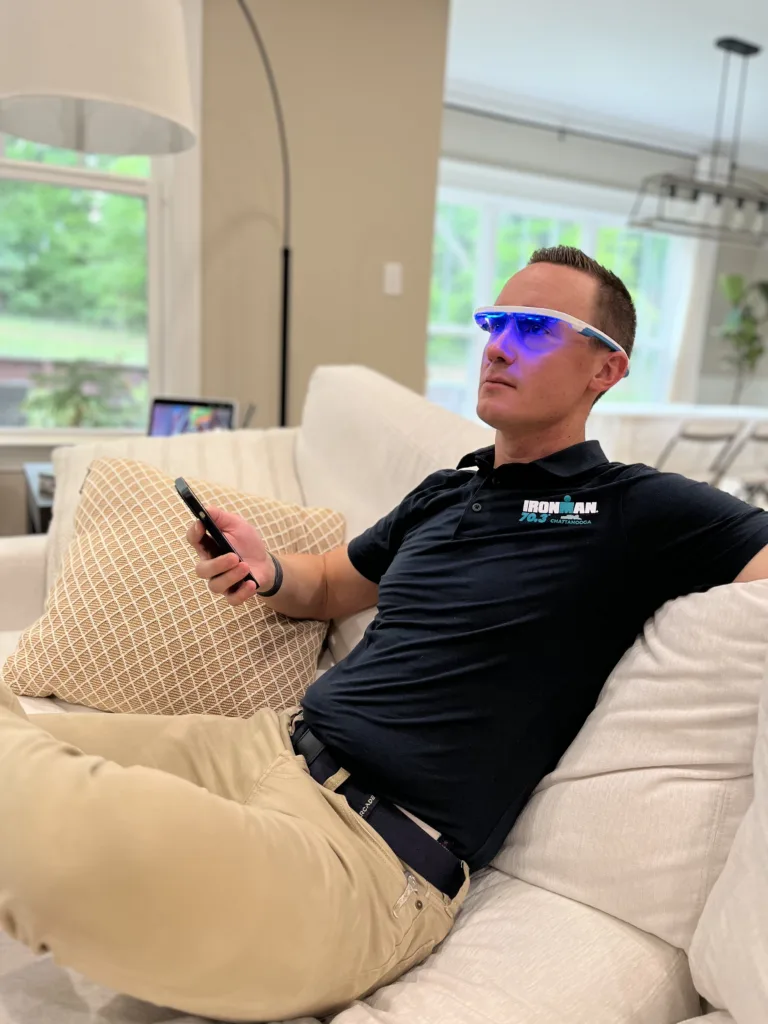 A man wearing blue light therapy glasses.